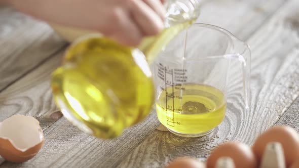 Measure Out The Vegetable Oil To Add To The Dough. Pour Oil In Measuring Cup. Preparing Ingredients