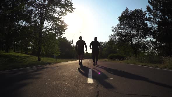 Two Sporty Man Walking on the Street