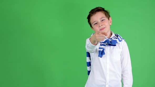 Young Handsome Child Boy Points To Camera - Green Screen - Studio