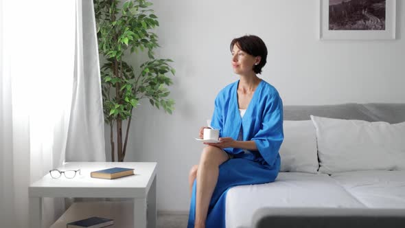 Woman Drinking Coffee in Morning