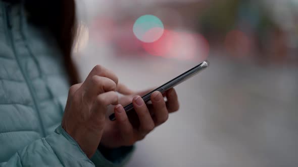 Female User is Typing Message on Smartphone and Sending in Online Chat Closeup of Hands