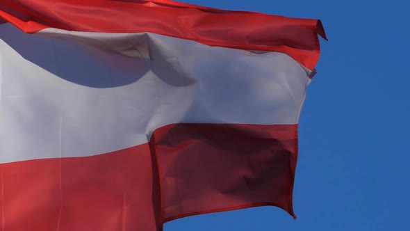 The national austrian flag waving in the wind.