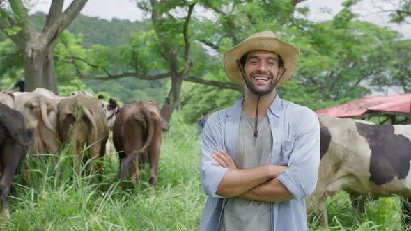 Portrait of Caucasian male dairy farmer working alone outdoors in farm.