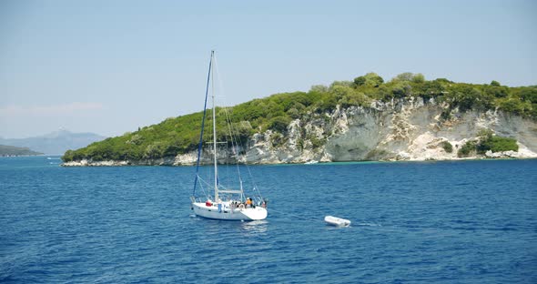 Catamaran Yacht Boat Sailing in Open Blue Sea Between Ionian Islands