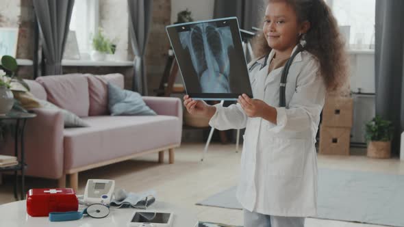 Portrait of Little Girl Playing Doctor