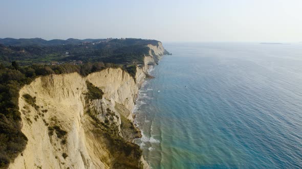 Drone Over Coastline Cliffs And Sea At Sunrise Of Cape Drastis