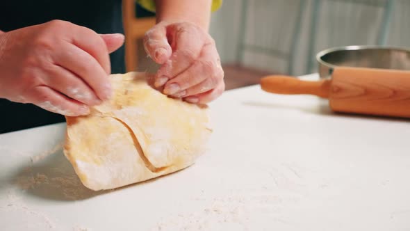 Close Up of Grandmother Hands Kneading