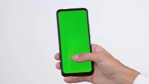 Male Hand Using Smartphone with Green Screen