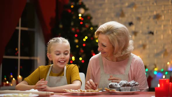 Beautiful Aged Lady and Girl Having Fun, Preparing Xmas Biscuits, Happy Holiday