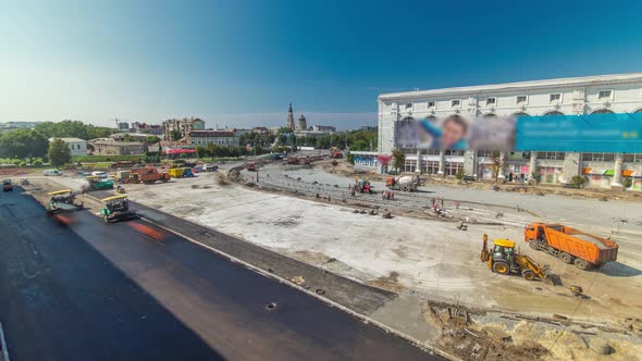 Workers Operating Asphalt Paver Machines During Road Construction and Repairing Works Aerial