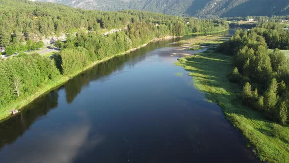 The Hallingdal river in Norway - Flowing gently besides road rv7 at late sunny summer day - Norway a