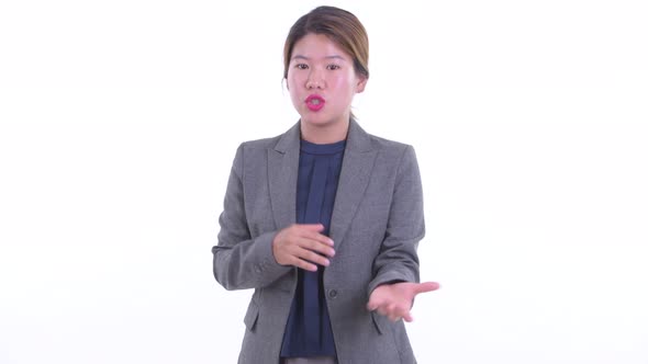 Young Asian Businesswoman Explaining Something