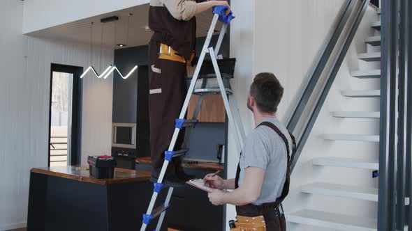 Handymen Fixing Problem in Clients House