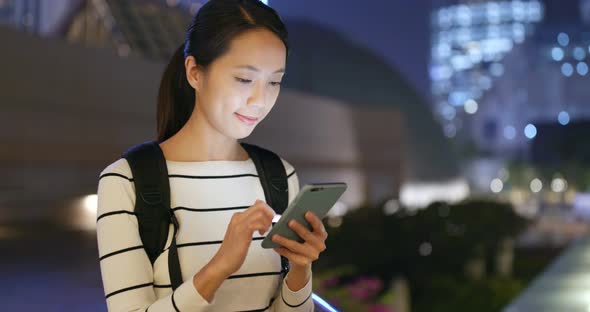 Woman use of smart phone in city 