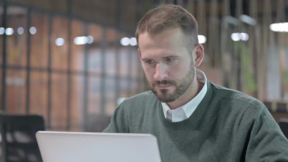 Close Up Shoot of Upset Man Get Shocked While Working