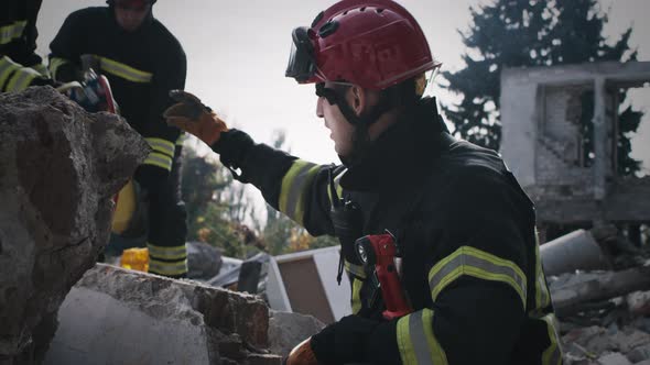 Male Rescuer Speaking with Colleagues