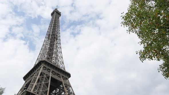 Lattice construction of Eiffel tower and symbol of France in front of cloudy sky 4K 2160p UltraHD fo