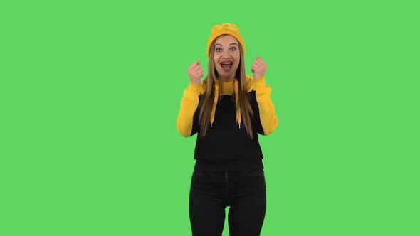 Modern Girl in Yellow Hat with Shocked Surprised Wow Face Expression and Having Fun. Green Screen
