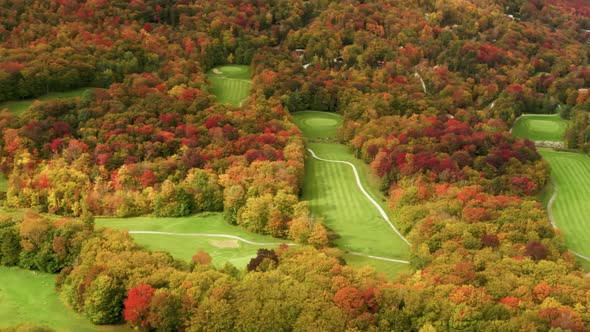 Cinematic Bright Green Golf Field at Killington Mountain Resort with Scenic Fall