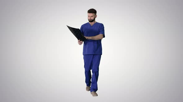 Surgeon Studying Mri Brain Scan While Walking on Gradient Background