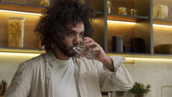 Egyptian Man Enjoys Drinking Water in Kitchen in Morning