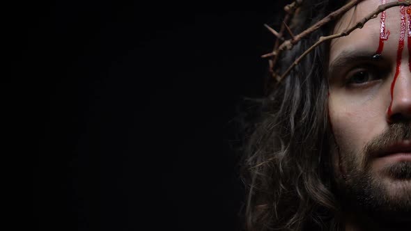 Messiah in Crown of Thorns Bleeding Looking Directly, Half-Face Closeup Template