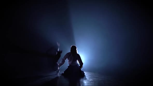 Aikido Master Technique Demonstration From a Sitting Position on Black Studio