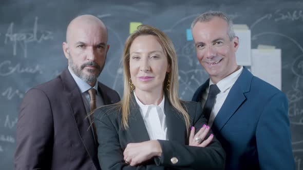 Portrait Shot of Three Business Partners Standing in Boardroom