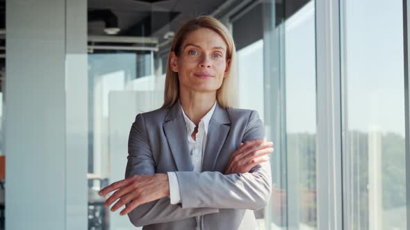 Portrait of Attractive Blonde Businesswoman Looking at the Camera Smiling