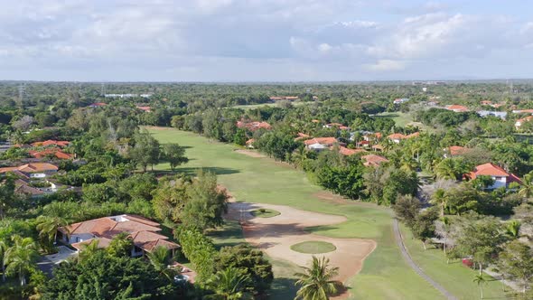 Drone flying over Metro Country Club at Juan Dolio in Dominican Republic. Aerial panoramic view