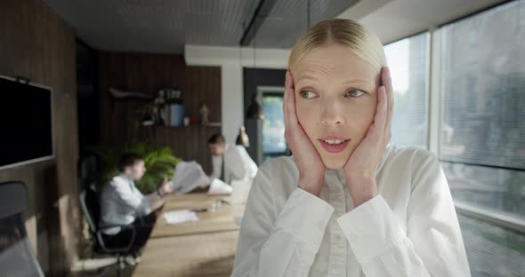 Workers Argue and Throw Papers to Each Other Faces at Business Meeting in the Background