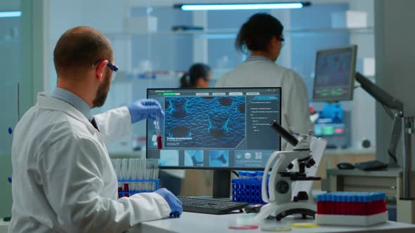 Scientist Man Examining Blood Samples