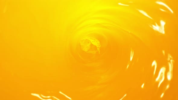 Super Slow Motion Shot of Orange Juice Whirl at 1000 Fps