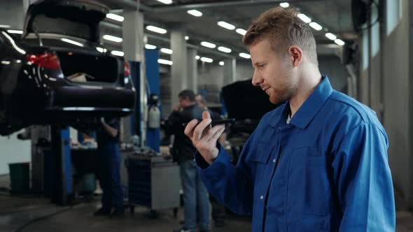 Man Voice Recognition with Smart Phone in Car Mechanic Workshop Service Factory Message Audio Welder