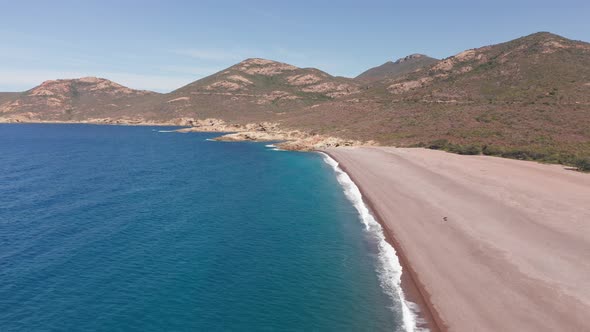 Aerial View of Desolated Red Sand Beach in a Hot Summer Day