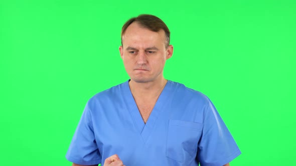 Portrait of Annoyed Medical Man. Green Screen