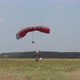 A Parachutist on a Guided Parachute Lands on the Field - VideoHive Item for Sale