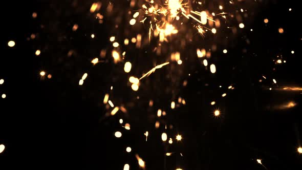 Bright Lights of New Year's Fireworks on a Black Background