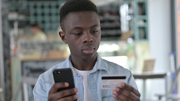 Successful Online Payment on Phone by African Man