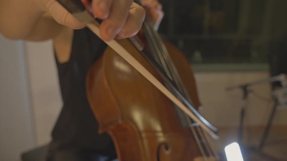 Musician playing the cello slowmotion