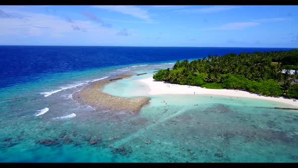 Aerial flying over landscape of perfect resort beach voyage by blue ocean and white sand background 