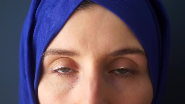 Portrait of a Muslim Woman on a Dark Background Close Up