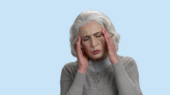 Mature Woman Suffers From Headache.