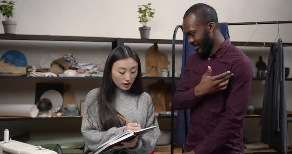 Diverse Designers Coworkers Talking in the Workshop