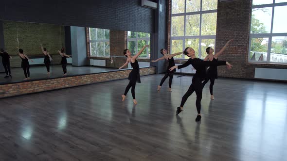 Beautiful Ballerinas Training on Dance Floor