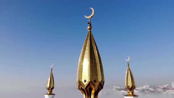 Golden crescent on the minaret of the mosque.