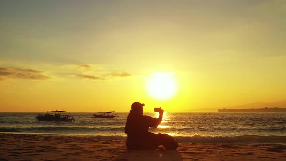 Young fun woman on holiday having fun at the beach on summer white sand and blue 4K background