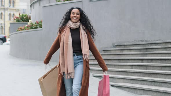 Happy Carefree Brunette Girl Young Woman Shopper Consumer Shopaholic in Stylish Coat Walking City
