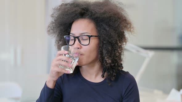 African Woman Having Toothache While Drinking Water