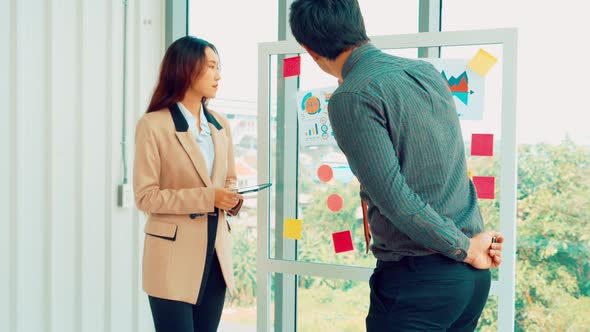 Business People Work on Project Planning Board